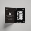 Open black card with white text and graphics on a gray background