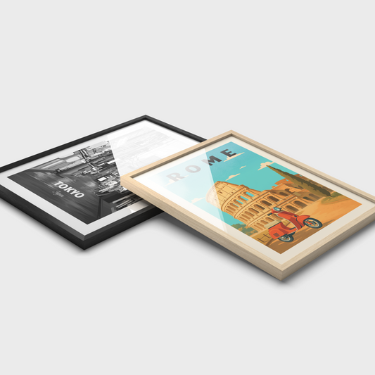 Two framed travel artworks on a light gray background