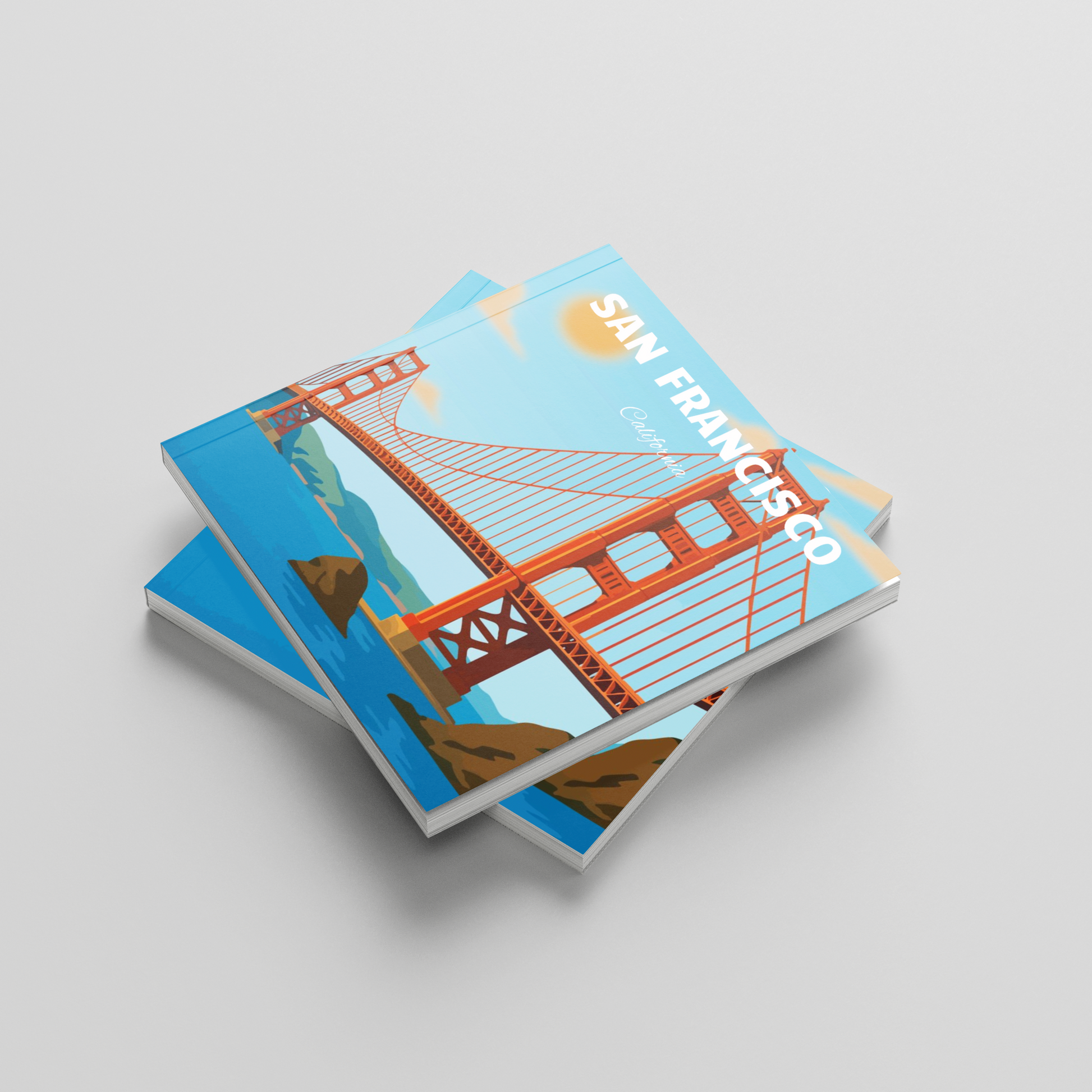 A stack of travel photobooks featuring an illustration of the Golden Gate Bridge in San Francisco, California, set against a clean light gray background.