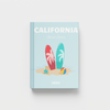 California travel photobook with beach-themed cover on a light blue background