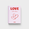 Pink photobook titled 'LOVE Our Story' with red text and hearts on a white background