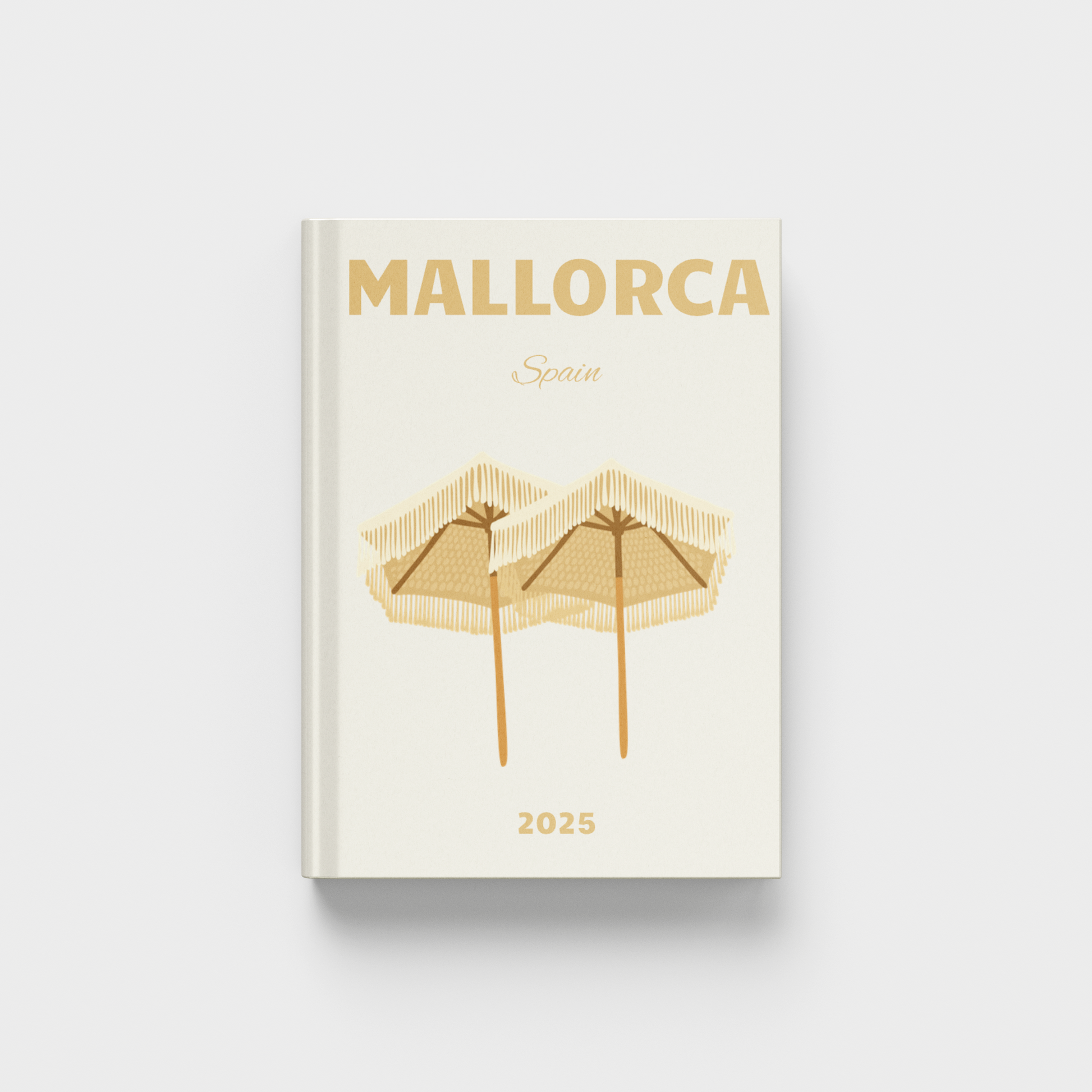 Cream photobook with 'Mallorca' and 'Spain' text on a white background