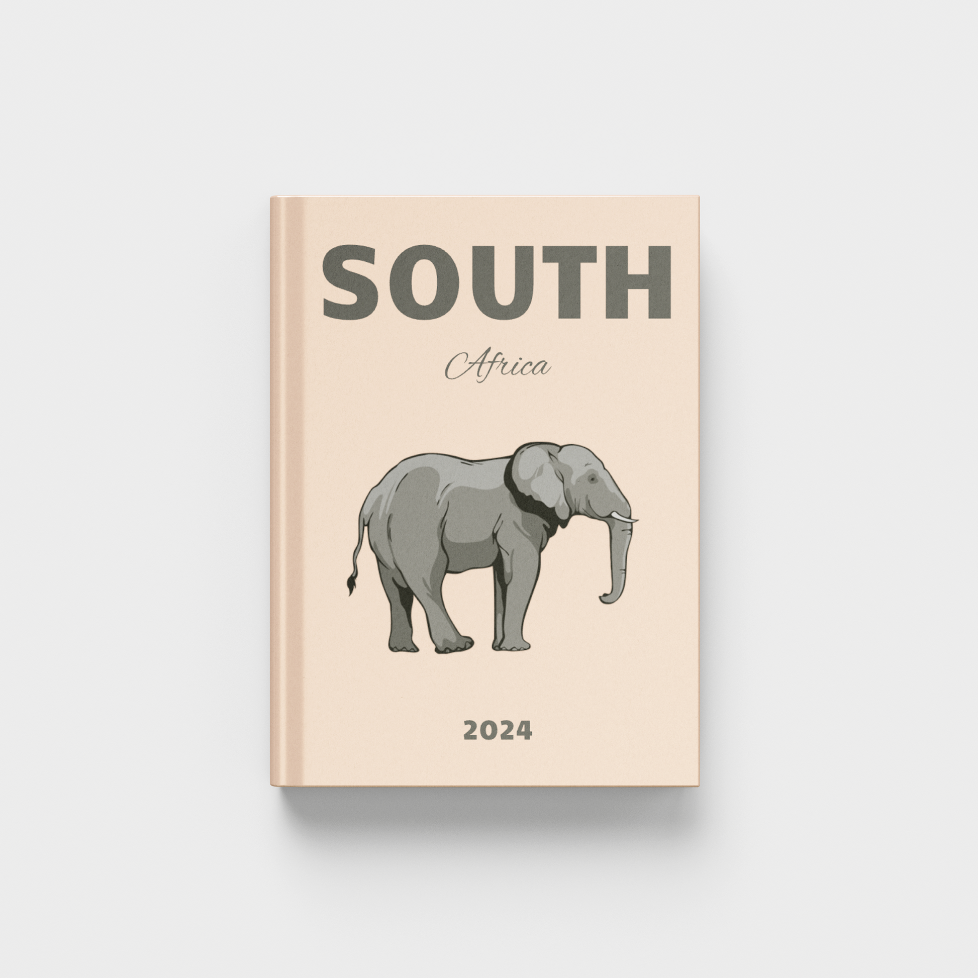 photobook with an elephant illustration and 'South Africa' text on a beige cover against a white background