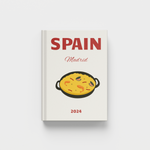photobook cover with 'Spain Madrid 2024' text and a pan of food illustration on a white background