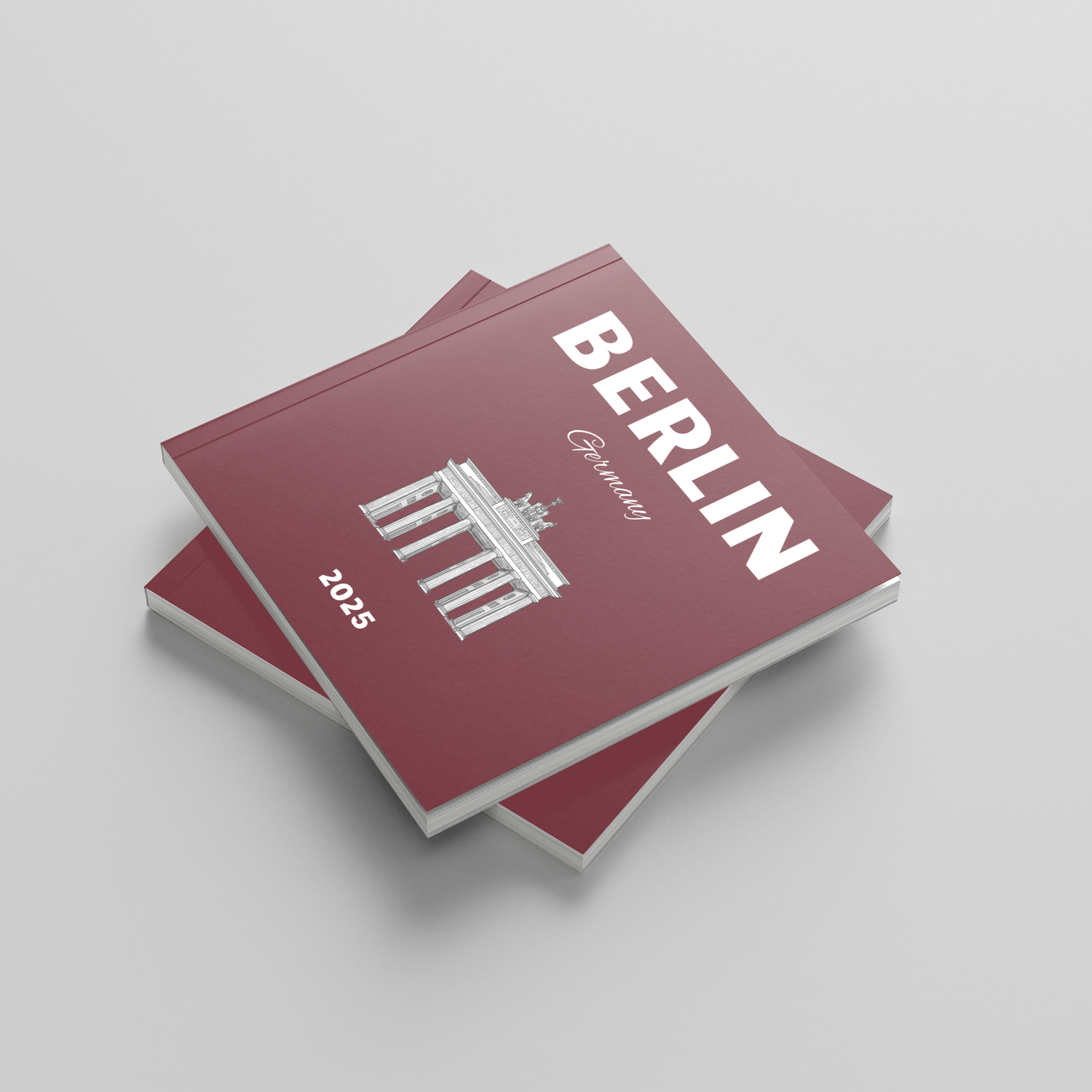Red square photobook titled 'Berlin' with architectural design on a light gray background