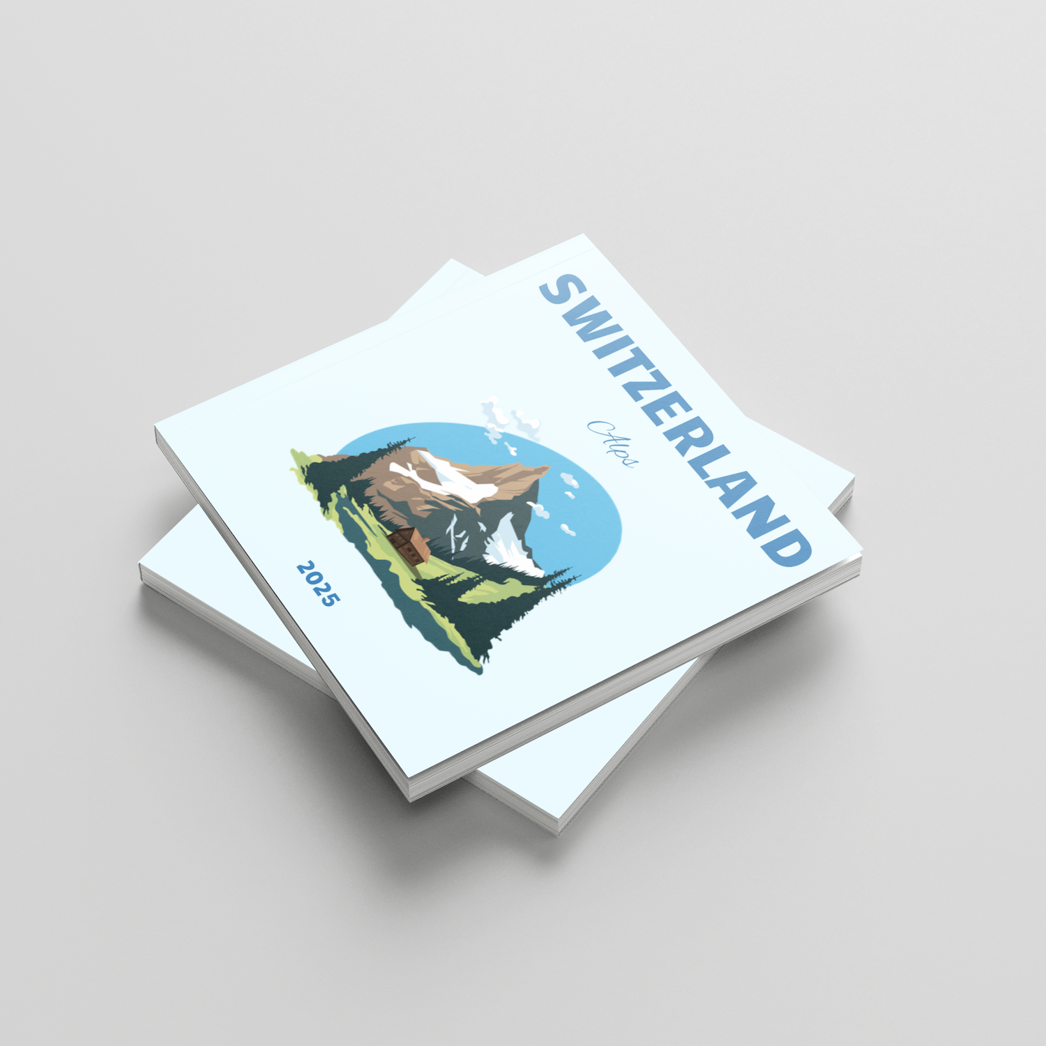 Stack of square photobooks with a Switzerland cover design on a light gray background