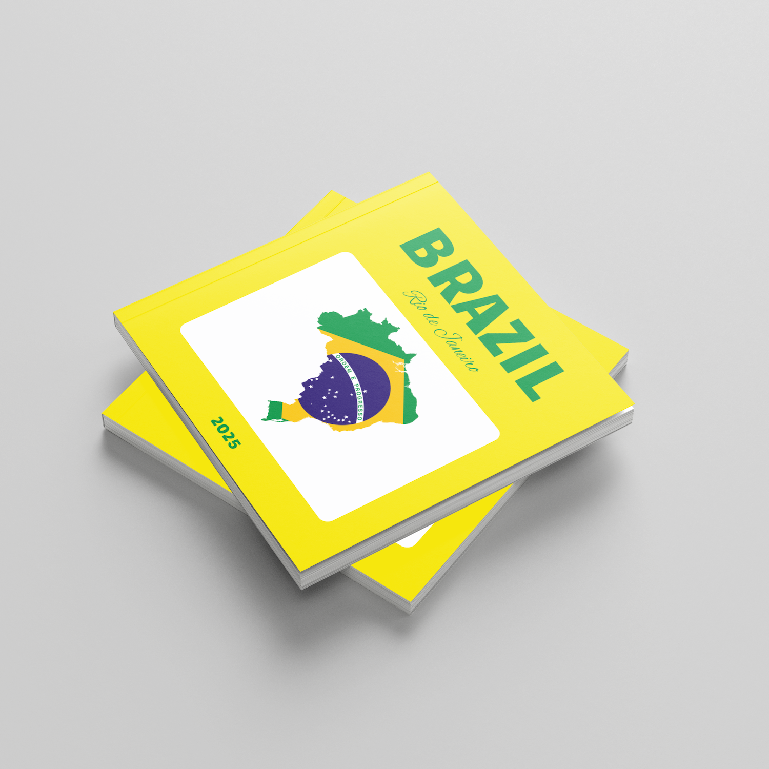 Stack of photobooks with a Brazilian flag design on a gray background