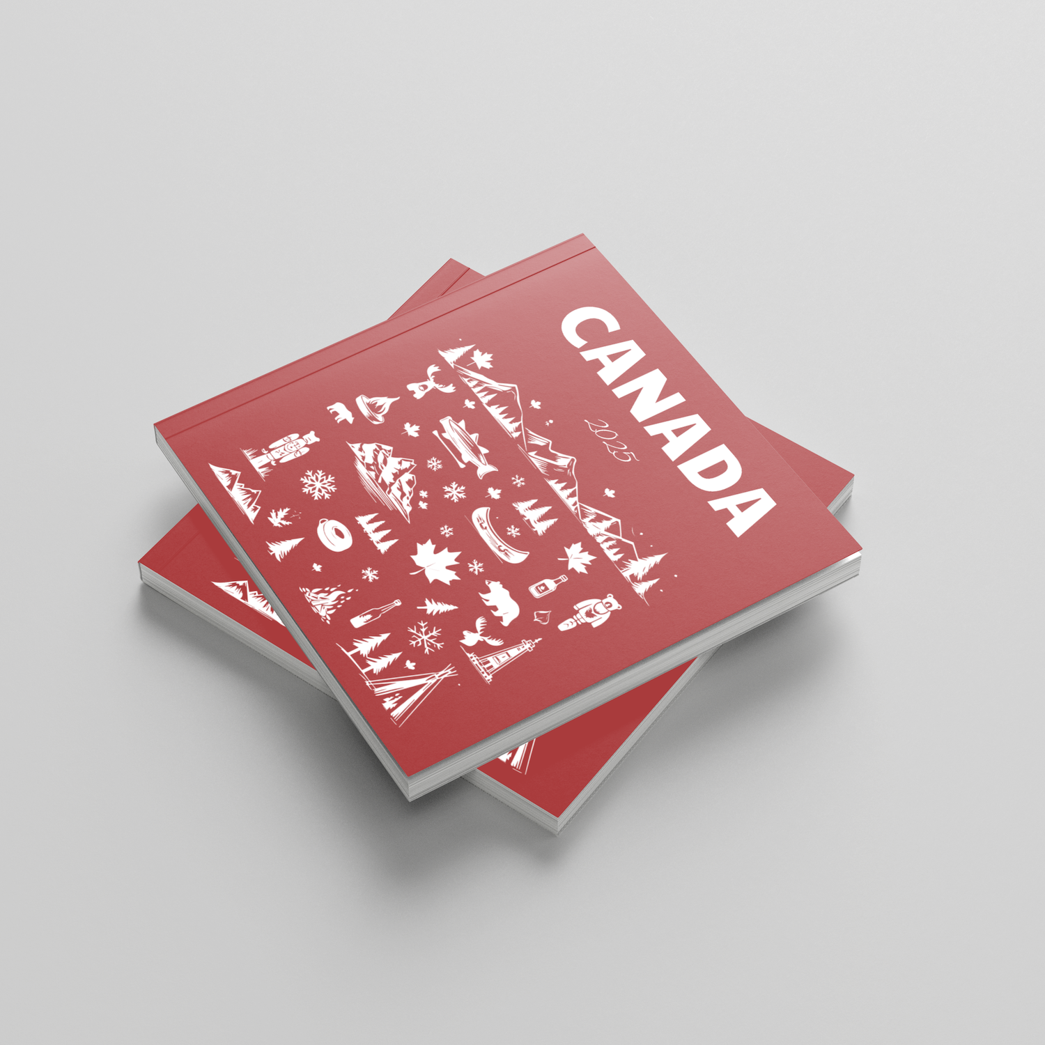 Red photobooks with 'Canada' text and illustrations on a light gray background