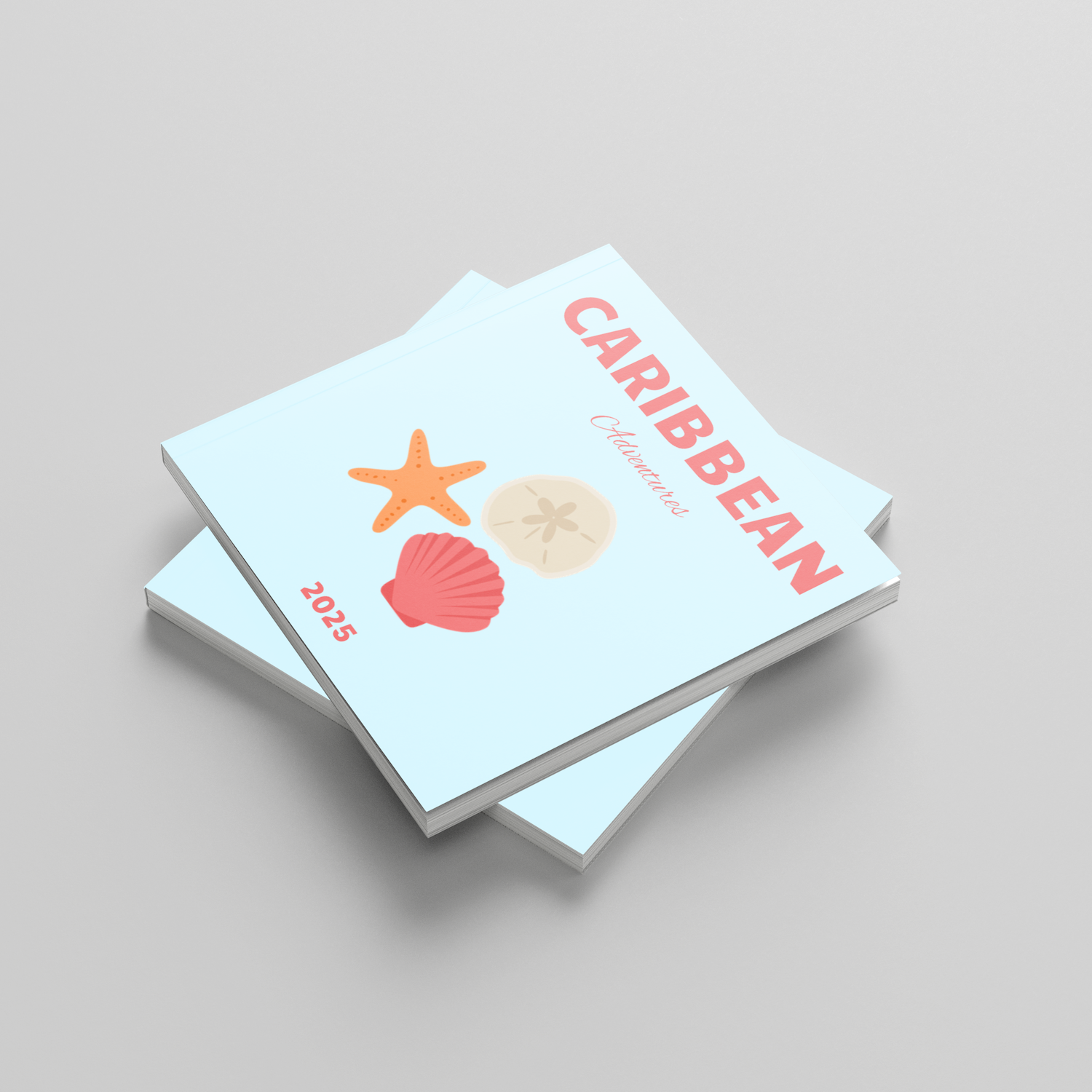 Two photobooks titled 'Caribbean' with shell and starfish illustrations on a light gray background