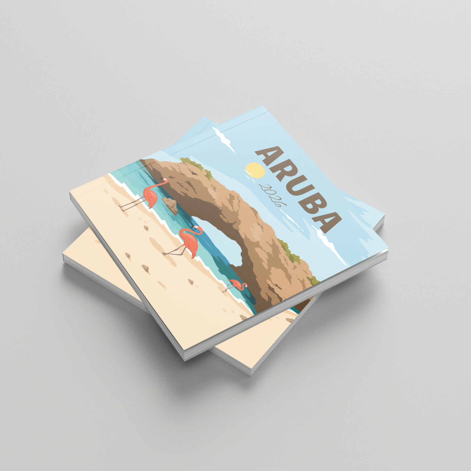Two square photobooks titled 'Aruba' on a gray background