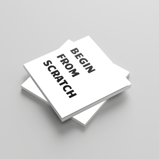 Stack of white books with 'Begin from Scratch' text on a gray background