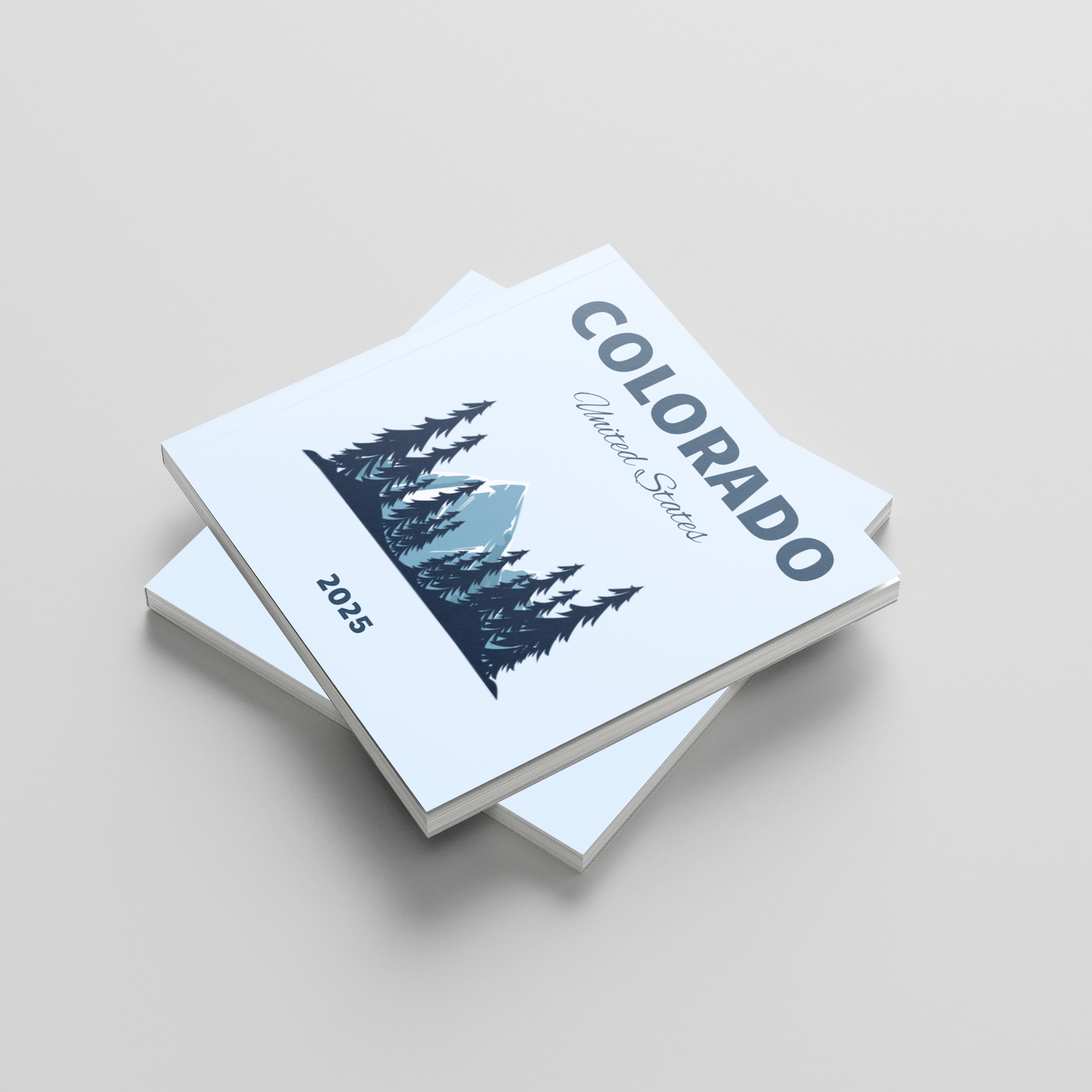 Stack of photobooks titled 'Colorado' on a light gray background