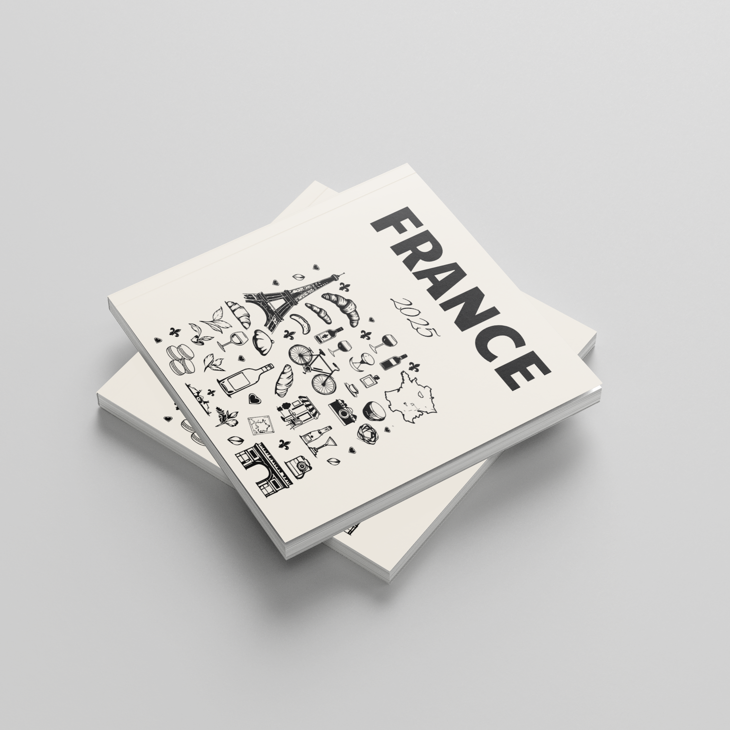 Two white photobooks with black text and graphics on a gray background