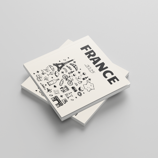 Two white photobooks with black text and graphics on a gray background