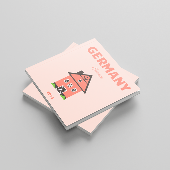 Two pink square photobooks with a house illustration and 'Germany' text on a gray background