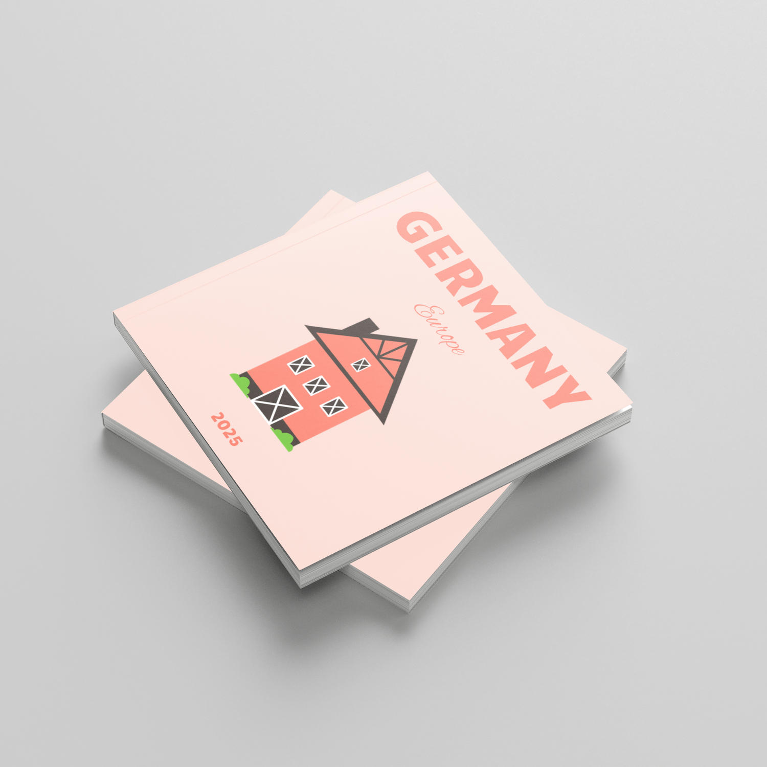 Two pink square photobooks with a house illustration and 'Germany' text on a gray background