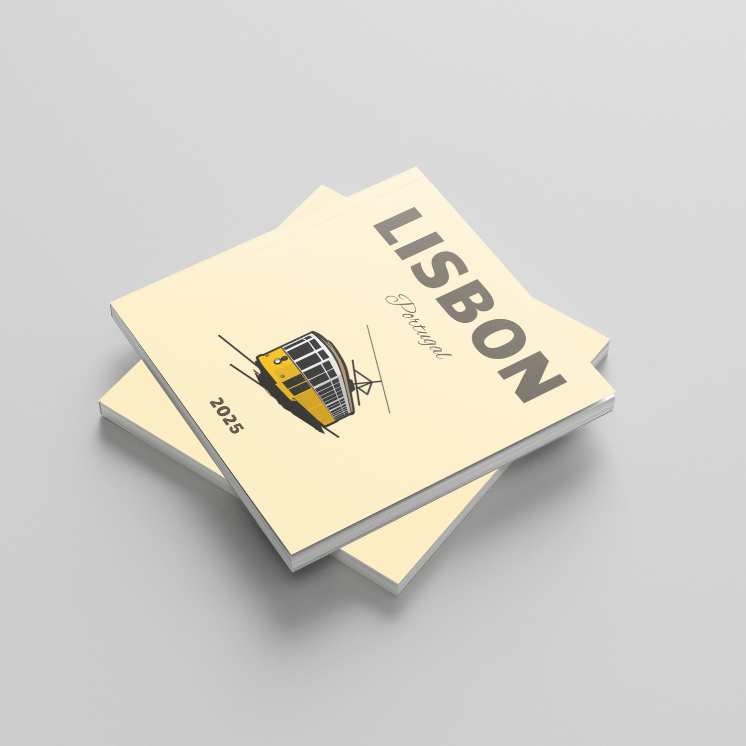 Two yellow square photobooks titled 'Lisbon' on a gray background