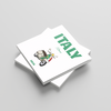 Stack of square photobooks with 'ITALY' and a vespa design on the cover against a light gray background