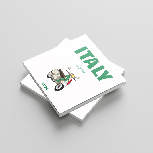 Stack of square photobooks with 'ITALY' and a vespa design on the cover against a light gray background