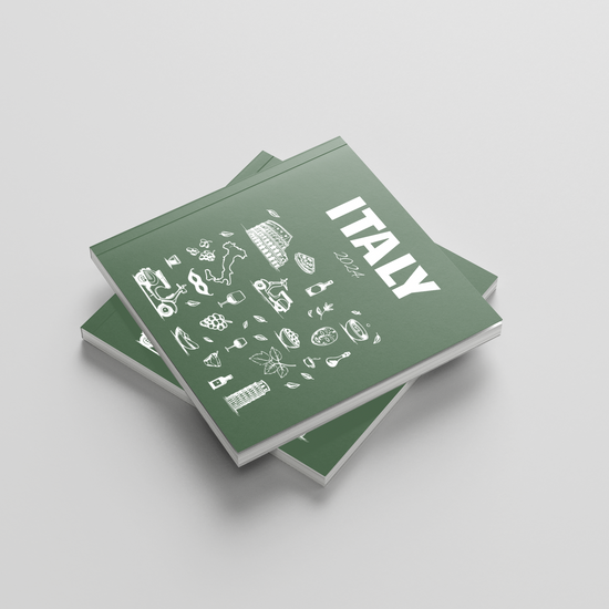 Two green photobooks with 'ITALY' and various icons on a light gray background