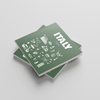 Two green photobooks with 'ITALY' and various icons on a light gray background