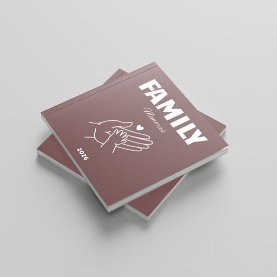 Two square photobooks titled 'FAMILY' with a hand illustration on a light gray background