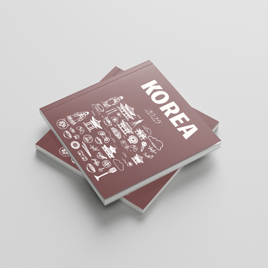 Stack of photobooks titled 'Korea' on a light gray background