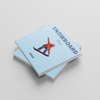 Two light blue square photobooks with a snowboarder illustration on a gray background