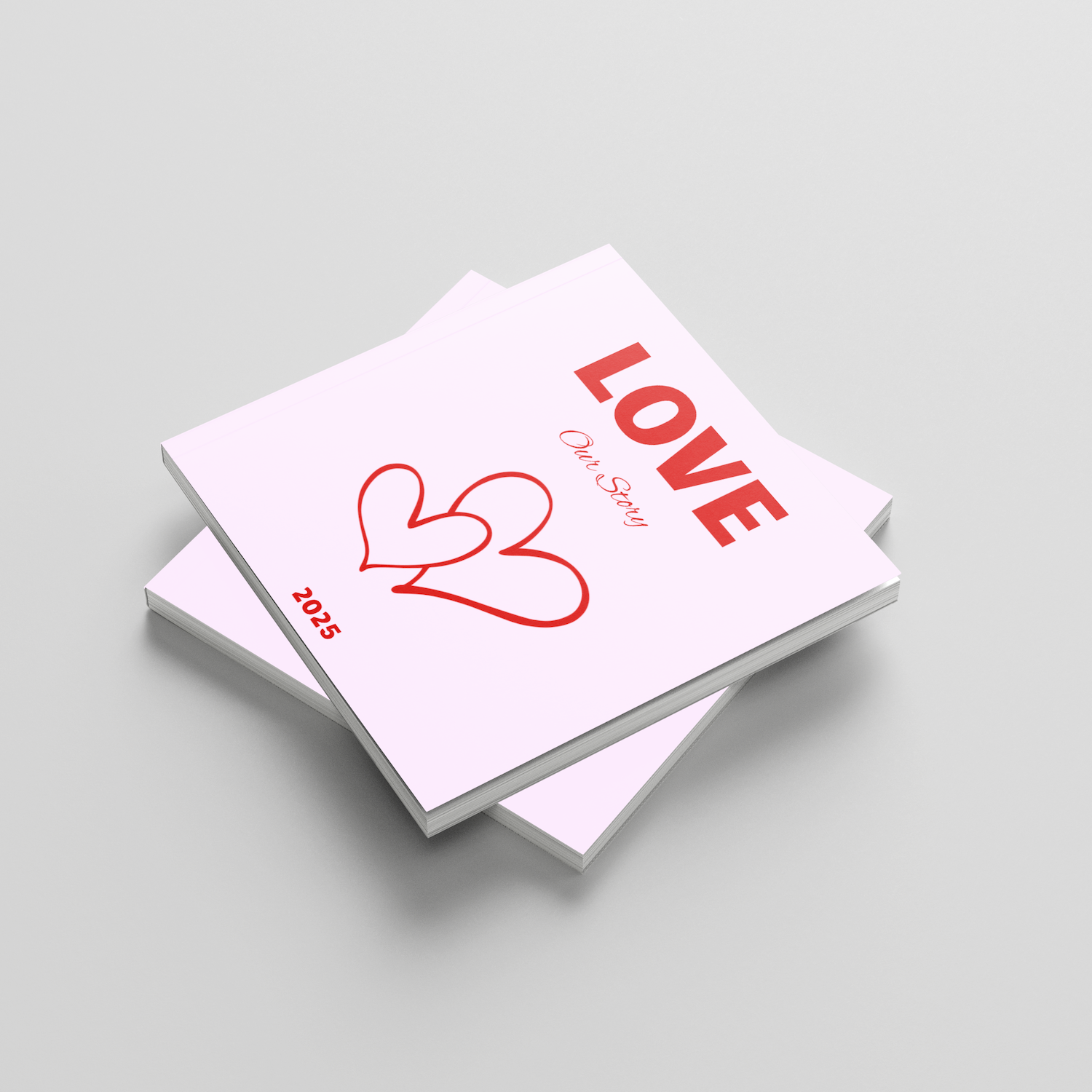 Two pink square photobooks with red hearts and 'LOVE' text on a light gray background
