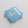 Two blue photobooks titled 'Beach' on a gray background
