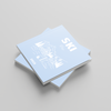 Two light blue photobooks titled 'SKI' on a gray background