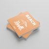 Two orange photobooks titled 'Beach' on a gray background