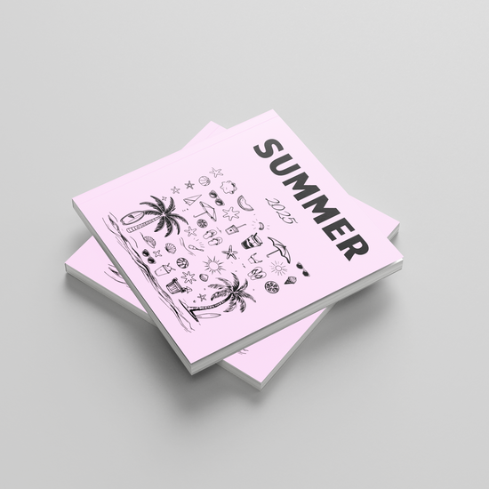 Stack of photobooks with 'Summer' design on a light gray background