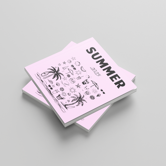 Stack of photobooks with 'Summer' design on a light gray background